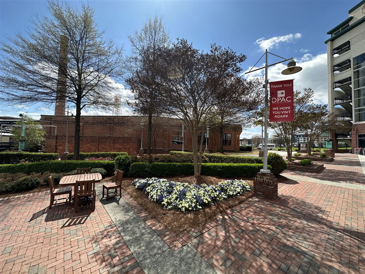 Brick patio and shade tree installation at a commercial property