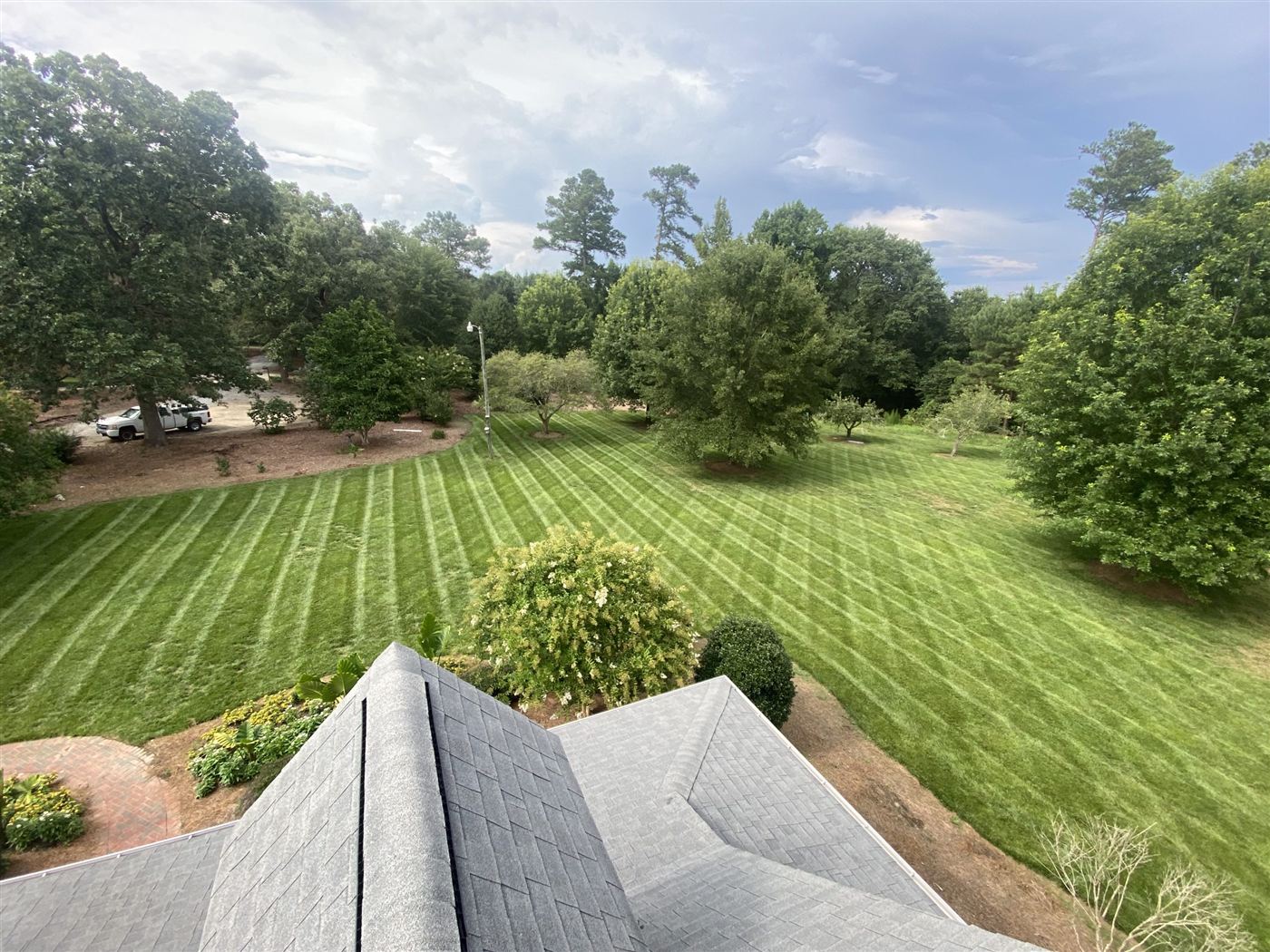 Aerial view of a striped lawn at an established Raleigh residence